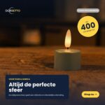 Zestaw 12 oliwkowozielonych, ładowalnych podgrzewaczy LED z płomieniami umieszczonych na drewnianej powierzchni. Podkreślono: czas świecenia do 400 godzin i pilot zdalnego sterowania. Branding i przycisk "Shop nu" są również widoczne.