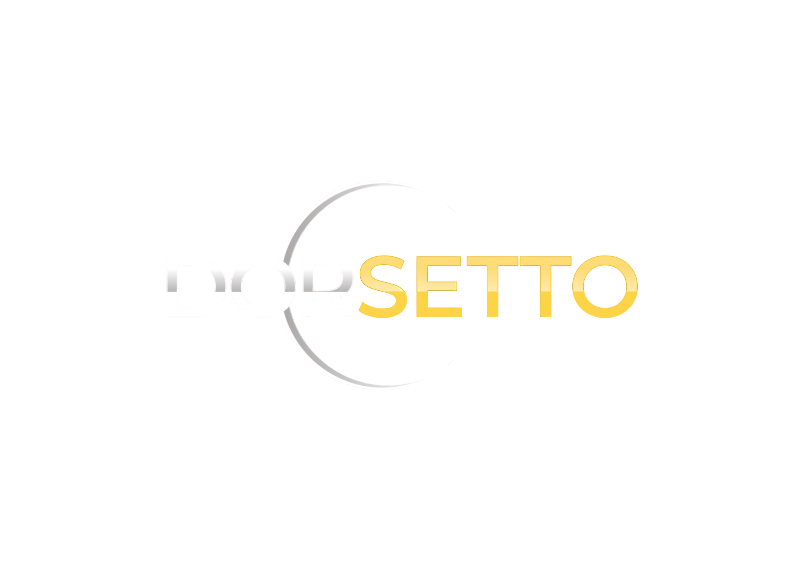 Obraz przedstawia słowo DORSETTO napisane wielkimi literami. Napis DOR jest jasnoszary, a napis SETTO jest żółty. Subtelne szare półkole częściowo otacza tekst na białym tle.